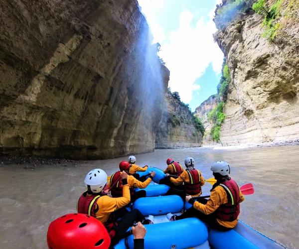 Guests rafting through the water in Osumi Canyon with Albania Rafting Group